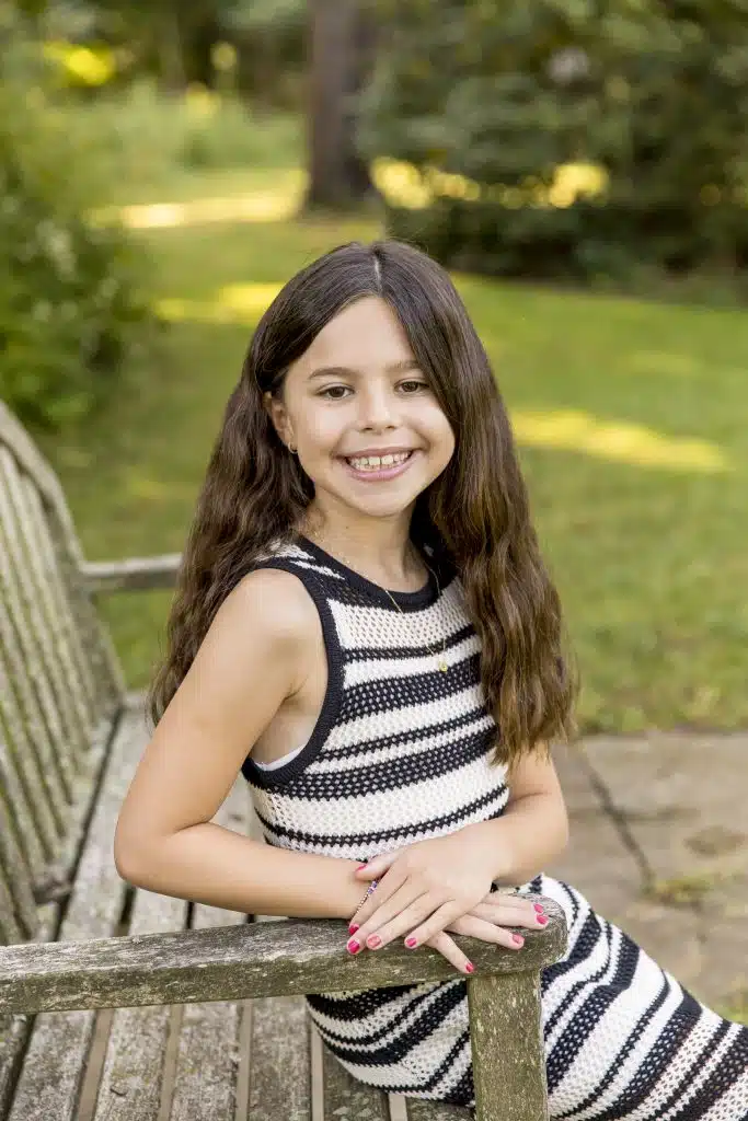 4th grade girl sitting on bench