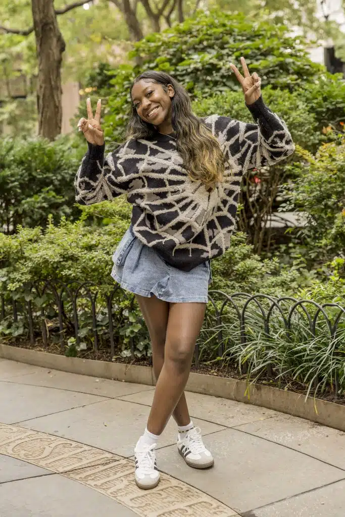 12 grade girl double peace signs full length