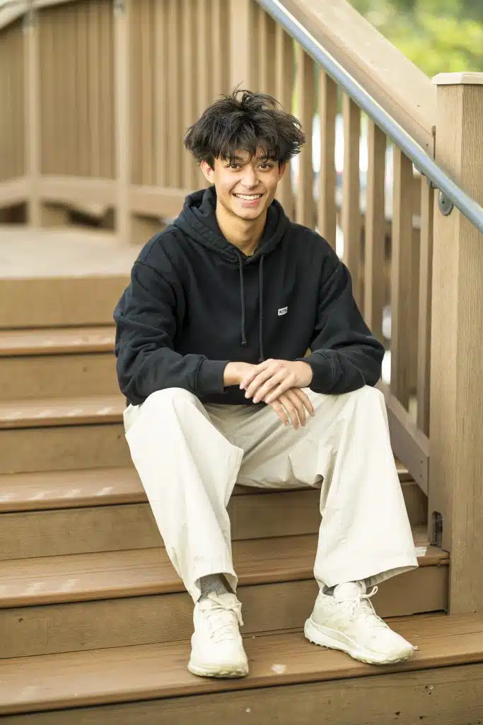11th grade boy on steps