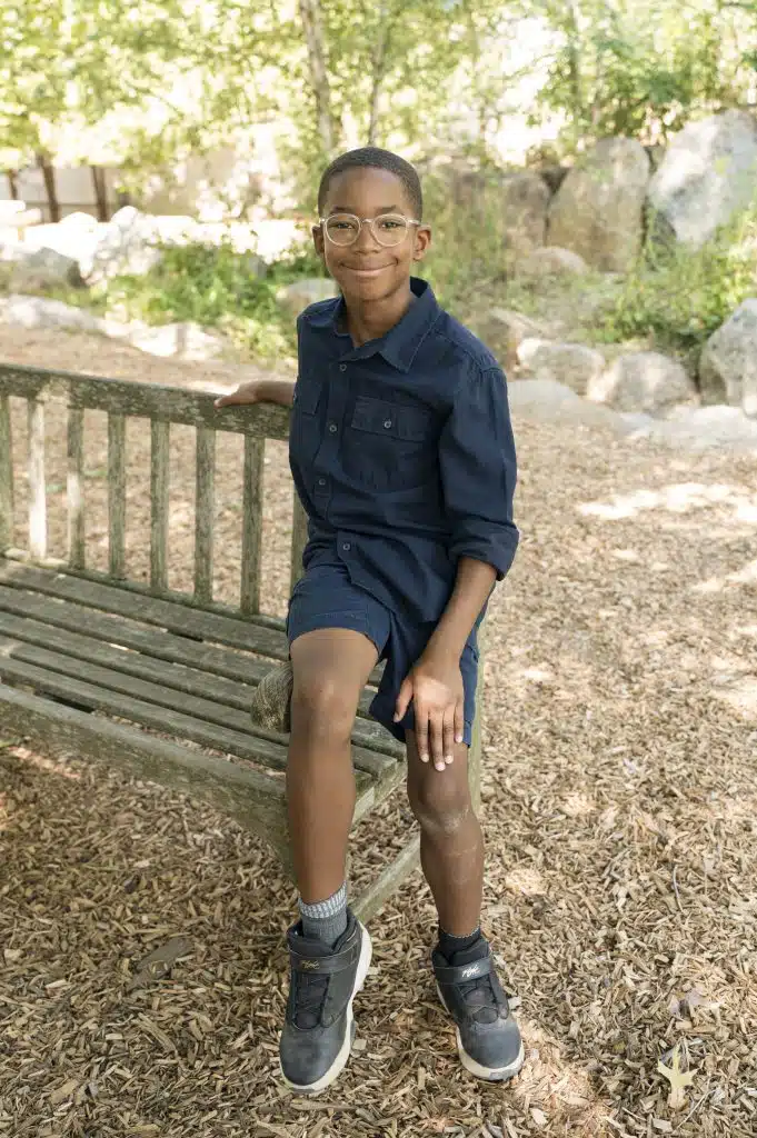 4th grade boy sitting on bench